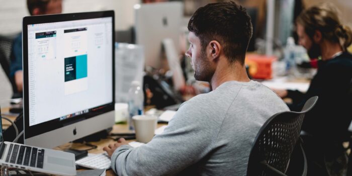 worker with computer trying to learn